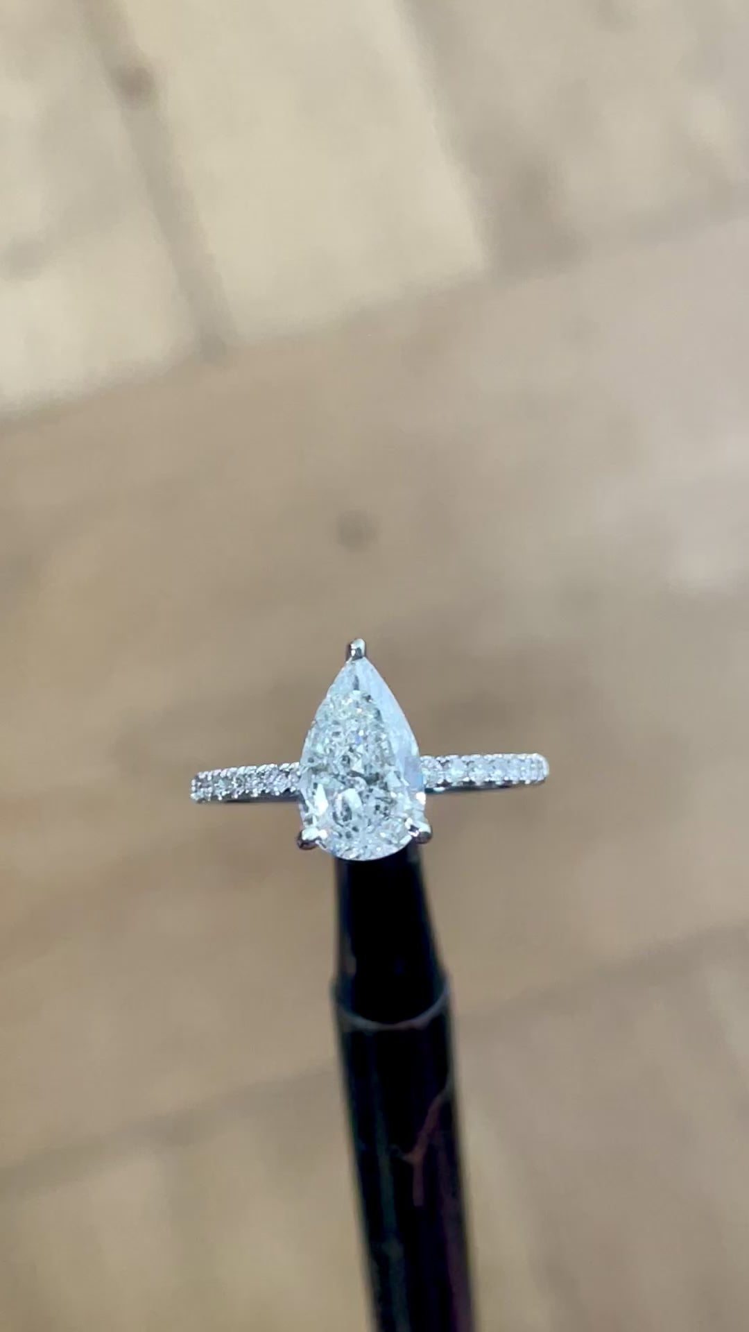 1.80 carats of diamonds, center diamond 1.50 carat pear shape